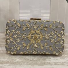 Introducing our designer Handmade clutches. With detailed intricate work, these purses are perfect for a daily wear as well as party wear. Comes with a detachable chain, you can easily switch from a hand purse to a crossbody. Spacious enough to fit daily essential needs as well as all kind of Phones. This gorgeous clutch in Peach with detailed embroidery is such an elegant piece. ALL SALES ARE FINAL. KINDLY MESSAGE ME FOR ANY INQUIRIES. Designer Clutch Shoulder Bag For Events, Elegant Rectangular Bag For Festive Occasions, Elegant Rectangular Bags For Festive Occasions, Elegant Clutch With Zari Work For Gift, Elegant Embroidered Shoulder Bag For Party, Designer Silver Clutch For Events, Festive Rectangular Evening Bag For Events, Elegant Festive Rectangular Bag, Elegant Pouch Shoulder Bag With Zari Work