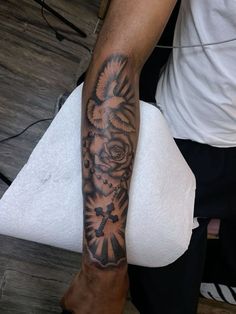 a man with a tattoo on his arm