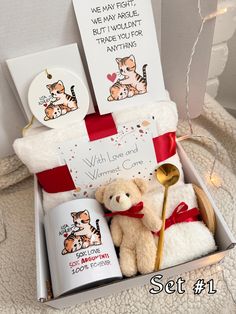 a teddy bear and two mugs in a gift box for someone's special day