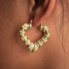 There is nothing more stylish than a pair of 10k Yellow Gold Heart Shaped Bamboo Hoop Earrings. They're a versatile look that can be paired with any kind of outfit and are suitable for any occasion. The click-snap earring closures support a full hoop shape that is crafted in resilient, eye-catching 10k Yellow Gold. Its gold composition is tougher than most gold types, allowing it to withstand years of daily wear. These hoops measure 1.67 inches from side to side and 1.37 inches from top to botto Bamboo Hoop Earrings, Bamboo Earrings, Pure Gold, Gold Heart, Heart Of Gold, 10k Gold, Gold Chains, Pink And Gold, My Jewellery