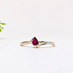 14K Solid Yellow GOLD Stackable One of a Kind Everyday Ring in 14k Gold For Her on Mothers Day from our Capsule Jewelry Collection. NATURAL RUBY Ring in 14k SOLID YELLOW GOLD. Ruby Pear Faceted Stone is set in Half Bezel Setting in our Factory. Gold Ring AAA+ Quality Ruby Precious Gemstone Ring. Etsy Handmade Jewelry, Handmade Ring For Wedding Gift , Engagement Gift  Anniversary Gift, Mothers Day Gift   (Stamped 585 /14k ) Ring. Perfect Gift For Everyday or Gift for a July Birthstone for Your Loved Ones. Christmas Gift  ►  DIMENSIONS : ◆ Gemstone : Ruby                                                                   ◆ Stone size : 3*5 mm                           ◆ Stone Shape : Pear                              ◆ Cut : Faceted  ◆ Gross Weight : 1.040 grams ◆ Stone Weight :  Ruby 0.30 Ct 14k Yellow Gold Emerald Ring For Promise, Fine Jewelry Pear-shaped Crystal Promise Ring, Pear-shaped Crystal Ring For Promise, Fine Jewelry, Pear-shaped Fine Jewelry Crystal Promise Ring, Pear-shaped Crystal Ring For Promise, 14k Gold Pear-shaped Diamond Promise Ring, Ruby Rings With Accent Stones For Promise, 14k Gold Solitaire Jewelry For Promise, 14k Gold Solitaire Promise Jewelry