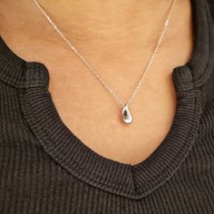 Our Silver Drop Charm Necklace features a thick silver water drop charm. This dainty necklace looks great layered with other minimalist necklaces or worn alone. We make our jewellery in small batches to reduce wastage. Our jewellery is designed with the modern Woman in mind, elegant, unique pieces with a classic touch. Our jewellery is great for gifting, whether it's Valentines, Mothers Day, Birthday or simply a gift for a friend, sister etc. Material- 925 Sterling Silver Length- 40 + 5cm Pendan Everyday Teardrop Sterling Silver Charm Necklaces, Everyday Sterling Silver Teardrop Charm Necklaces, Everyday Sterling Silver Teardrop Charm Necklace, Modern Everyday Teardrop Pendant Necklace, Modern Teardrop Pendant Necklace For Everyday, Dainty Sterling Silver Teardrop Charm Necklace, Dainty Teardrop Sterling Silver Charm Necklace, Minimalist Everyday Dangle Drop Necklace, Everyday Sterling Silver Teardrop Pendant Necklace