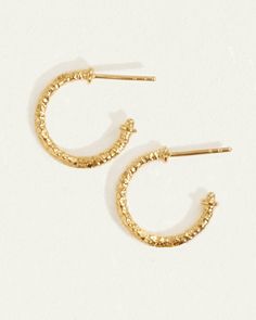 Small hoop earrings in textural 18k gold vermeil - perfect for stacking. Shop everyday hoops with character. Everyday Hammered Huggie Earrings, Textured Gold-plated Hoop Earrings, Hammered Small Hoop Huggie Earrings, Everyday Small Hoop Hammered Huggie Earrings, Everyday Small Hoop Huggie Earrings With Hammered Detail, Textured Gold Plated Hoop Earrings, Everyday Hammered Hoop Huggie Earrings, Hammered 14k Yellow Gold Huggie Earrings, 14k Yellow Gold Hammered Huggie Earrings