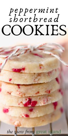 peppermint shortbread cookies are stacked on top of each other with white icing and sprinkles