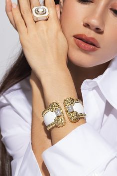 David Webb white enamel rope cuff bracelet in yellow gold. 18K Yellow Gold, Platinum, Enamel Brilliant-cut diamonds 2.60ctw Luxury White Diamond Jubilee Bracelet, Elegant Enamel Cuff Bracelet For Formal Occasions, Luxury Enamel Cuff Bracelet, White Luxury Jubilee Diamond Bracelet, Luxury Enamel Cuff Bracelet Bangle, Luxury Enamel Cuff Bangle Bracelet, Luxury Enamel Cuff Bangle, Luxury White Enamel Bracelets, Designer Enamel Bangle Jewelry