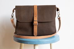 Hip, handmade shoulder bag brown smooth leather metal buckle dimensions: 27 - 20 - 4 cm inside compartment 17 - 10 cm back pocket 22 - 13 cm shoulder strap 110 cm Leather Sling Bag, Shoulder Bag Brown, Chic Leather, Brown Bag, Lily Collins, Leather Crossbody Purse, Brown Bags, Metal Buckles, Sling Bag