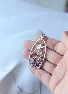 The size H 4 cm x W 3 cm (1 3/4 x 1 inch). Weight - 6g. You can buy it with the chain or without. The most delicate flower of the lotus can make someone very happy. I made this botanical jewelry of sterling silver, amethyst, and peach moonstone. This is a true work of art. It will emphasize your exquisite taste and status, and will also bring a lot of compliments. Lotus flower earrings https://www.etsy.com/listing/676137548/lotus-flower-earrings-sterling-silver?ref=shop_home_active_2&frs=1 O Flower Necklace Silver, Lotus Flower Necklace, Silver Flower Necklace, Dragonfly Pendant, Botanical Jewelry, Jewelry Wire, Peach Moonstone, Dragon Pendant, Amethyst Pendant