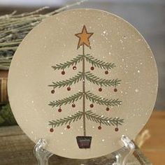 a glass plate with a christmas tree painted on it