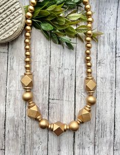 Excited to share this item from my #etsy shop: Gold wood bead statement necklace. Lightweight Gold Beaded Necklace. Chunky Bead Necklace. Gold. Handmade beaded necklace. Gold Beaded Necklace With Wooden Beads, Elegant Gold Beaded Necklaces With Wooden Beads, Gold Long Necklace With Wooden Beads, Luxury Statement Beaded Necklace With Wooden Beads, Wood Bead Necklace Gold, Easy Necklace, Black Opal Pendant, Crystal Point Necklace, Chunky Bead Necklaces