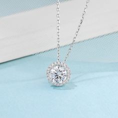 Product Information 
  


Metal: 
925 Sterling Silver 


SKU: 
MS-LSHD-031/ MS-LSHD-032


Rhodium: 
Yes 


Nickle Free: 
Yes 


Necklace Length:
18''


Gem Type: 
Moissanite


Stone Color: 
White


Stone Cut: 
Round Cut


Earrings Stone Weight:
1.0ct


Necklace Stone Weight:
1.0ct


Average Clarity: 
FL-IF 


Average Color: 
D-E 











LOOKS THE SAME AS DIAMOND (WITH NAKED EYES)
While diamonds are graded on the 4 C’s scale (Cut, Clarity, Color, Carat), AINUOSHI Moissanite® are not diamond, and are graded solely on color. The cut and clarity are similar across different qualities.

Moissanite have higher dispersion and refractive index, and the result is that the fire color is better than diamonds. One good moissanite is almost perfect. AINUOSHI Moissanite® will bring you the best expe Halo Jewelry, Solitaire Necklace, Halo Design, Moissanite Necklace, Halo Pendant, Moissanite Jewelry, Matching Necklaces, Metal Necklaces, Moissanite Diamonds