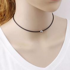 Classic black choker silver or gold ball charm simple chic everyday wear matches any outfit This product description features a classic black choker with a silver or gold ball charm, perfect for simple and chic everyday wear that effortlessly complements any outfit. Simple Adjustable Choker Jewelry, Everyday Clavicle Chain Choker, Silver Round Pendant Choker, Adjustable Dainty Black Choker, Adjustable Clavicle Chain Choker, Classic Black Choker Jewelry, Simple Choker As Gift, Casual Everyday Jewelry Choker, Casual Black Choker Jewelry