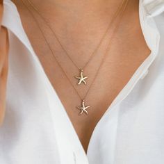 "With this lovely starfish-shaped necklace, you may add a hint of the sea to your ensemble. This necklace, which is made of premium materials, is both fashionable and durable. Any fan of the seaside will like this item since the complex pattern perfectly reflects the spirit of the starfish. This necklace will lend a touch of refinement to any outfit, no matter how it is styled. This necklace is ideal as a present for a friend or as a treat for yourself, and it will undoubtedly become a prized ad Starfish Gold Necklace, Star Fish Necklace, Yellow Gold Starfish Jewelry In Ocean-inspired Style, Elegant Starfish Charm Jewelry For Gifts, Yellow Gold Starfish Ocean-inspired Jewelry, Elegant Starfish Charm Jewelry As Gift, Elegant Starfish Charm Jewelry Gift, Ocean-inspired Starfish Yellow Gold Jewelry, Ocean-inspired Jewelry With Star Charm As Gift