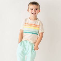 Created with comfort in mind, this short sleeve basic tee is perfect for days on the playground. The soft cotton knit makes it easy to pair with shorts. Rainbow Relaxed Fit Short Sleeve T-shirt, Casual Rainbow Print Short Sleeve T-shirt, White Short Sleeve T-shirt With Rainbow Print, Rainbow Print Short Sleeve T-shirt, Playful Rainbow Cotton T-shirt, Basic Tee, Striped Shorts, Cotton Knit, Good Vibes