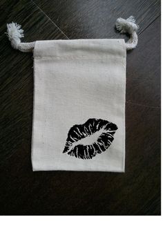 a drawstring bag with an image of a woman's hand on it