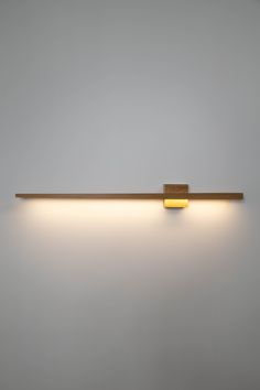 a light that is on the side of a wall with some lights attached to it