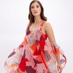 Lively With Its Playful Patterns, This Frank Lyman Dress Is A Stunning Choice. It Features A Plunging Neckline And Exposed Shoulders, All Held Together By A Sheer, Chiffon Cape. Drapey And Elegant, This Stunning Choice Is An Undeniably Appropriate Choice For The Summer Season. 246142 100% Polyester No Pockets No Zipper Our Model Is 5'9"/175 Cm And Wears A Size 6. Approximate Length (Size 12): 41" - 104 Cm Pink Silk A-line Midi Dress, Pink Silk Maxi Dress For Cocktail, Pink Fitted Beachwear Dress, Fitted Pink Beachwear Dress, Pink A-line Maxi Dress For Daywear, Pink Fitted Sleeveless Silk Dress, Pink Floral Print Beachwear Midi Dress, Pink Silk V-neck Party Dress, Pink V-neck Silk Party Dress