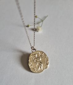 "Antique Coin pendant necklace, White gold coin necklace, 14k gold necklace, Roman coin necklace, 9k coin necklace, Solid gold necklace This 14k solid White gold necklace was 100% handmade and has an antique Roman coin for a pendant. This ancient coin necklace is unique and beautiful and will serve you long and well. Materials: The gold coin pendant and chain are made of 14k solid white gold. You can also buy the pendant only if you wish. Dimensions: The 14k gold necklace is available in multipl Yellow Gold Coin Pendant Necklace In Sterling Silver, Yellow Gold Sterling Silver Coin Medallion Necklace, Tarnish Resistant Sterling Silver Coin Necklace In Yellow Gold, White Gold Necklace With Round Disc Coin Pendant, White Gold Necklace With Coin Pendant, Sterling Silver Gold Medallion Coin Necklace, Yellow Gold Sterling Silver Coin Necklace, 14k Gold Pendant Coin Necklace, Tarnish Resistant, White Gold Round Coin Necklace