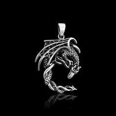 Sterling Silver Dragon Pendant with Oxidized Finish Pendant Height (including loop, excluding bail): Approx 36mm Please other photos for size reference Sterling Silver Necklace Chains also available as add on.  Please see sizing chart and select length preference from Options list Shipping Policy:  Please see FAQs below Silver Elephants, Silver Cross Pendant, Sterling Silver Cross Pendant, Silver Dragon, Elephant Pendant, Dragon Pendant, Sterling Silver Chain Necklace, Sterling Silver Cross, Hamsa Hand