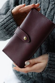 This wallet embodies the perfect blend of elegance and functionality, featuring a slim bifold design that caters to the modern woman's need for a sleek and compact accessory. Crafted from high-quality leather, this slim bifold wallet is a testament to meticulous craftsmanship, ensuring durability and a refined aesthetic. As a gift for a daughter or sister, the timeless design and practicality of this wallet make it a cherished accessory for everyday use. Either commemorating a special occasion o Elegant Card Holder With Interior Slots, Modern Brown Clutch For Gift, Modern Brown Clutch For A Gift, Modern Brown Clutch As Gift, Modern Brown Clutch Perfect For Gifts, Elegant Wallets With Rfid Blocking As Gift, Classic Burgundy Wallets With Interior Card Slots, Classic Burgundy Wallet With Interior Card Slots, Elegant Rfid Blocking Wallets As Gift