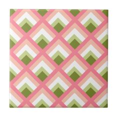 a pink and green tile with an argyle pattern on the bottom, in different colors