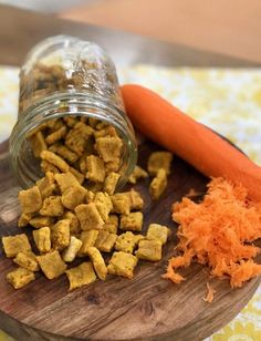 carrots and dog food are on a cutting board