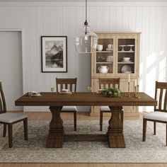 a dining room table and chairs in front of a china cabinet