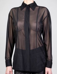 TECHNOCRACYBlack tulle dropped shoulder blouse w/ concealed press button fastening. 100% polyesterModel wears size SFront length: 68cmBack length (excl. collar): 74cmSleeve length: 49cmCuff: 7cmShoulder: 18,5cm Sheer Long Sleeve Shirt For Work, Elegant Sheer Tops For Workwear, Elegant Long Sleeve Nylon Tops, Fall Blouse With Sheer Sleeves For Layering, Chic Sheer Long Sleeve Blouse, Formal Sheer Long Sleeve Blouse, Sheer Long Sleeve Blouse For Work, Formal Long Sleeve Sheer Blouse, Sheer Long Sleeve Shirt For Fall