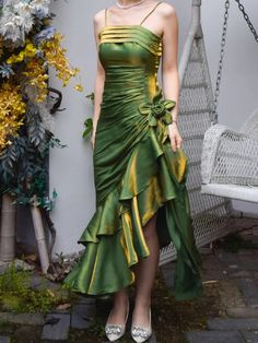 Step into timeless elegance with our Grass Green Vintage Floral Dress. This exquisite prom gown features an asymmetrical hem that adds a touch of modern flair to its classic silhouette. The delicate spaghetti straps gracefully highlight your shoulders, making it perfect for a memorable adult ceremony or any special occasion. The lush grass green fabric evokes a sense of vintage charm while ensuring you stand out in any crowd.  Garment Size   	 		 			Size 			XS 			S 			M 			L 			XL 		 		 			Bust Prom Dress Inspiration Elegant, Midsummer Prom Dress, Hawaiian Homecoming Dress, Hippy Prom Dress, Hoco Unique Dresses, Luxury Brand Dresses, 80s Inspired Prom Dress, Green And Pink Prom Dress, Fun Short Dresses