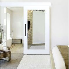 a bedroom with white walls and carpeted flooring