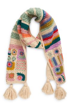 a multicolored knitted scarf with tassels