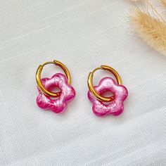 Pink Resin Flower Charm Huggie Hoop Earrings - Hypoallergenic Stainless Steel, Hypoallergenic Earrings, Handmade Jewelry, Gift For Her Add a touch of charm to your style with these delightful colored resin flower-shaped charm huggie hoop earrings. Each earring features a meticulously crafted flower charm made from high-quality uv resin, suspended from a sleek 19mm stainless steel huggie hoop. The stainless steel hoop offers durability and a hypoallergenic design, making it ideal for those with s Cheap Pink Huggie Earrings Gift, Hoop Flower Charm Earrings As Gift, Pink Nickel-free Huggie Hoop Earrings, Nickel-free Pink Huggie Hoop Earrings, Pink Hypoallergenic Huggie Earrings, Pink Huggie Hoop Earrings Nickel Free, Handmade Pink Hoop Earrings Gift, Hypoallergenic Flower Shaped Hoop Earrings For Gift, Hypoallergenic Flower-shaped Hoop Earrings Gift