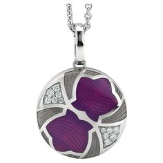 Round locket pendant necklace, 18k white gold, Merian Collection, opalescent purple and grey vitreous enamel, 12 diamonds, total 0.19 ct G VS, brilliant cut About the creator Victor Mayer Victor Mayer is internationally renowned for elegant timeless designs and unrivalled expertise in historic craftsmanship. Lovers of the extraordinary appreciate the beauty of Victor Mayer's designs, which use extremely rare techniques such as genuine enamel or elaborate engravings. Since 1890, the company has s Enamel Locket, Vitreous Enamel, Round Locket, Purple Diamond, Locket Pendant Necklace, Gold Locket, Grey Diamond, Art Deco Diamond, Gold Collection