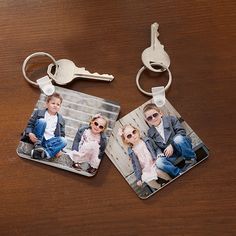 two keychains that have photos on them and one has a pair of sunglasses