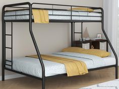 a black metal bunk bed with two yellow pillows on it's bottom and sides