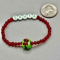 Gemstone Santa beaded stretch bracelet Genuine Jade approximately 7 inches Present is glass strung on professional latex free elastic. We do our best to choose each stone carefully and purposeful for every piece.. However there might be slight differences in color size shape and clarity which makes each item unique and one of a kind.Each piece of jewelry will come in a colored satin drawstring bag for it’s protection and storage or to be ready to give as a gift.Our gemstone jewelry are all origi Beaded Inelastic Bracelet As Gift, Inelastic Beaded Bracelets As Gifts, Inelastic Beaded Bracelet As A Gift, Adjustable Colorful Beads Stretch Bracelet As Gift, Flexible Beaded Stretch Bracelet Gift, Flexible Jewelry With Colorful Beads For Gifts, Flexible Colorful Beaded Jewelry For Gifts, Flexible Stretch Bracelet With Spacer Beads As Gift, Adjustable Beaded Stretch Bracelet For Christmas