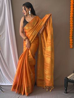 Add a touch of elegance and sophistication to your ethnic wear collection with our attractive orange zari weaving tissue silk saree with blouse. This stunning saree features intricate zari weaving work, a rich pallu, and tassels that add a luxurious feel to the overall look.
The vibrant orange color is perfect for the festive season, weddings, and special occasions, making you stand out in the crowd. This saree includes its soft and lightweight tissue silk fabric, which drapes beautifully and is Luxury Orange Saree With Zari Work, Luxury Orange Pre-draped Saree With Zari Work, Luxury Orange Slub Silk Traditional Wear, Luxury Orange Tissue Silk Blouse Piece, Luxury Orange Saree For Eid, Luxury Orange Pre-draped Saree For Festive Occasions, Luxury Orange Blouse For Festive Occasions, Luxury Orange Saree With Unstitched Blouse, Luxury Orange Pre-draped Saree With Unstitched Blouse