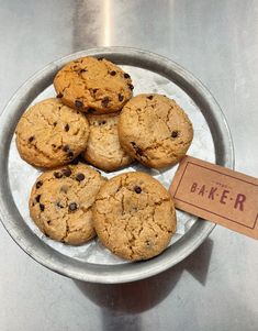 a plate full of cookies with a sign on it