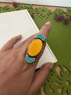 Complement your personality with this trendy unique design.  The gorgeous ring is beautifully handcrafted by our skilled Indian craftsmen in stones and beads. Material: German Silver.  Turquoise, coral and lapis lazuli. The size of the ring is US 8.5. Weight of the ring: 33 grams. American Diamond Ring, Rose Gold Flower Ring, Indian Rings, Stone Necklace Set, Choker Designs, Gold Flower Ring, Vintage Choker, Bollywood Jewelry, Classic Earrings