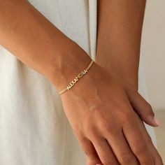 ✦ 𝐈𝐭𝐞𝐦 𝐃𝐞𝐬𝐜𝐫𝐢𝐩𝐭𝐢𝐨𝐧 Personalize our all-time customer favorite, the Nelly Bracelet, with your name or the name of a loved one. The curb chain and modern font create a bold, classic look that's perfect for the everyday. It's a heartfelt gift for any occasion, from engagements and anniversaries, to birthdays or holiday gatherings. This meaningful piece can be layered with other jewelry, or can shine on its own.  ✦ Product Details:- Material: High Quality 925 Sterling Silver Finish: 1 Jewelry Minimal, Curb Chain Bracelet, Name Jewelry, Birthday Gift For Her, Heartfelt Gifts, Holiday Gathering, Curb Chain, Birthday Gifts For Her, Chain Link Bracelet