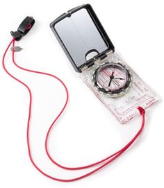 a compass with a red cord attached to it