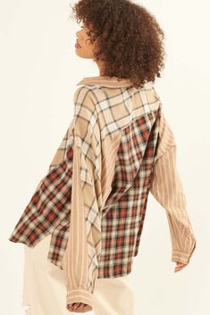 Plaid shirt. Colorblock design in contrasting plaids and stripes. Collared neckline. Button front closure. Long sleeves with buttoned cuffs. Yoke back. Side-split shirttail hem. Loose, oversized fit. 100% Cotton. Imported. Designed in LA. Model wears size S. Boho Shirts, Side Split, Diy Fashion, Plaid Shirt, Oversized Fits, Color Blocking, Button Up Shirts, Button Up, Split