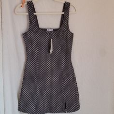 The Is A Dress From Urban Outfitters. It Is A Size Medium. It's Dark Gray With Small White Daisies On It. This Item Is Nwt. It Measures 17 Inches From Armpit To Armpit And 32 Inches From Shoulder To Hem Fitted Lined Sundress For Date Night, Fitted Cotton Sundress For Date Night, Fitted A-line Lined Sundress, Fitted Mini Dress From Urban Outfitters, Fitted Mini Dress By Urban Outfitters, Fitted Urban Outfitters Mini Dress, Urban Outfitters Fitted Summer Mini Dress, Fitted Mini Dress By Urban Outfitters For Summer, Fitted Cotton Sundress With Lining