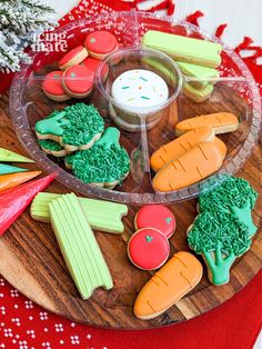 a platter with carrots, broccoli, celery and radishes on it