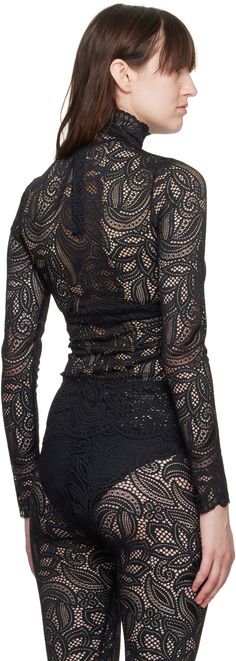 Sheer stretch nylon-blend lace blouse. Floral pattern and scalloped edges throughout. · Turtleneck · Concealed zip closure at back Supplier color: Black Stretch Lace Top With Lace Closure, Fitted Tops With Lace Closure, Scalloped Lace Long Sleeve Top For Night Out, Elegant Fitted Top With Lace Closure, Elegant Fitted Tops With Lace Closure, Elegant Black Top With Lace Closure, Fitted Scalloped Lace Blouse, Black Lace Top With Lace Closure, Fitted Lace Top With Lace Closure