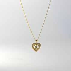 Own a tangible representation of love in the most elegant way. This 14K solid gold heart-shaped pendant is the most sophisticated way of showing love to your special someone. Whether that be yourself or a significant other. This gold heart pendant will captivate not only the eyes but also the heart of the person who will receive it. Made from the finest 14K solid gold material, this heart-shaped pendant is a real symbolism of luxury and of love. Make it yours and add it to your collection. This Fine Jewelry Heart Pendant Necklace For Wedding, Wedding Heart Pendant Necklace In Fine Jewelry Style, Wedding Fine Jewelry Heart Pendant Necklace, Gold Heart Necklace With Hallmark, Gold Engraved Heart Pendant Necklace, Gold Heart Necklace For Anniversary, Wedding Heart Pendant Necklace With Birthstone, Wedding Heart Necklace With Birthstone Pendant, 14k Gold Heart Initial Pendant Necklace For Anniversary