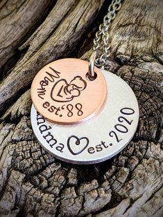 "Personalized hand stamped grandma necklace. Gift for grandma. Custom mothers day gift for grandma. Nana necklace. Memaw gift. First time grandma gift. Pregnancy announcment to mom. Custom pregnant announcement. Hand stamped and made to order. Made from a 5/8\" copper disc, stamped with a mama and baby stamp and stamped with the phrase, \"Mom est. (year of your choice),\" then a 7/8\" aluminum disc, stamped with the phrase, \"grandma est. (year of your choice).\" Stacked together and attached to Hand Stamped Round Necklaces For Mother's Day, Hand Stamped Jewelry For Birthday And Mother's Day, Hand Stamped Round Necklace For Mother's Day, Hand-stamped Jewelry For Birthday And Mother's Day, Meaningful Hand Stamped Necklace For Mom, Hand Stamped Necklace For Mother's Day, Meaningful Stamped Necklace For Mother's Day, Meaningful Stamped Necklaces For Mother's Day, Birthday Jewelry For Mother's Day