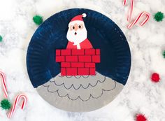 a paper plate with a santa clause on it