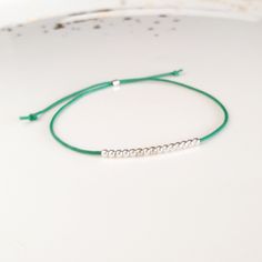 Minimalist, wearable and delicate silver multicolor thread bracelet available in several colors. Length: 20cm adjustable knot. Width: 2mm. Fully adjustable, Handmade in Spain. More colors available in this product => https://www.etsy.com/listing/845364478/tiny-simple-cord-sterling-silver-wish Ideal for a gift and for combinate with other bracelets. All our products are presented in a white organza bag. ♡ Made with love in Valencia ♡ ----------------------------- Discover the NICTE bracelets c Cheap Minimalist Bracelet With Adjustable Cord, Minimalist Silver Friendship Bracelets, Minimalist Friendship Bracelets With Round Beads, Minimalist Sterling Silver Friendship Bracelets, Minimalist Handmade Friendship Bracelets, Adjustable Friendship Bracelets With Silver Beads As Gift, Minimalist Sterling Silver Bracelets With Adjustable Length, Minimalist Silver Friendship Bracelet With Tiny Beads, Minimalist Adjustable Friendship Bracelets