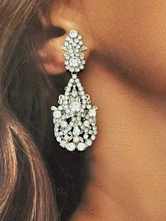 Our luxurious and glamourous DILARA earrings are perfect for any occasion. It's silhouette is created with light-catching crystals to reflect its beauty. They will create a polished look with little effort for a high-style special event. Handcrafted Highest Quality Swarovski / Cubic Zirconia Platinum plated Guards against scratches and tarnish. approximate size 2.06" length 1" width Nickel free Free shipping in USA Earrings For Bride, Teardrop Bridal Earrings, Artistic Earrings, Crystals Earrings, Bridal Earrings Chandelier, Crystal Bridal Tiaras, Bridal Necklace Set, Luxury Earrings, Gold Statement Earrings