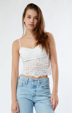 Embrace feminine elegance with the Lace Cami Top from LA Hearts. This timeless cami features delicate lace fabric with added stretch, creating a chic and romantic look. Perfect for layering or standing on its own, the Lace Cami Top adds a touch of sophistication to any outfit.


	Allover lace fabric
	Good stretch
	Semi-sheer
	V-neckline
	Adjustable straps
	Cropped length
	Scalloped hem
	Self: 90% nylon, 10% spandex; Lining: 100% polyester
	Machine washable
	Model is wearing a size small Feminine Elegance, Lace Cami Top, Romantic Look, Lace Cami, Good Stretches, Scalloped Hem, Cami Top, Cami Tops, Lace Fabric